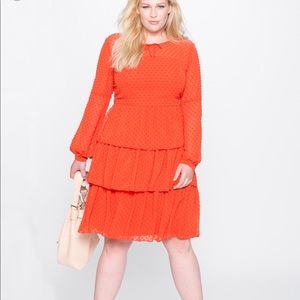 Orange tiered ruffle dress.